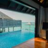 Elegant overwater villa in Maldives with infinity pool and ocean view for a serene getaway.