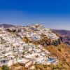 A breathtaking view of Santorini's iconic whitewashed buildings against a vibrant blue sea.