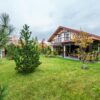 Charming suburban residence with lush greenery and a spacious yard, ideal for a tranquil lifestyle.